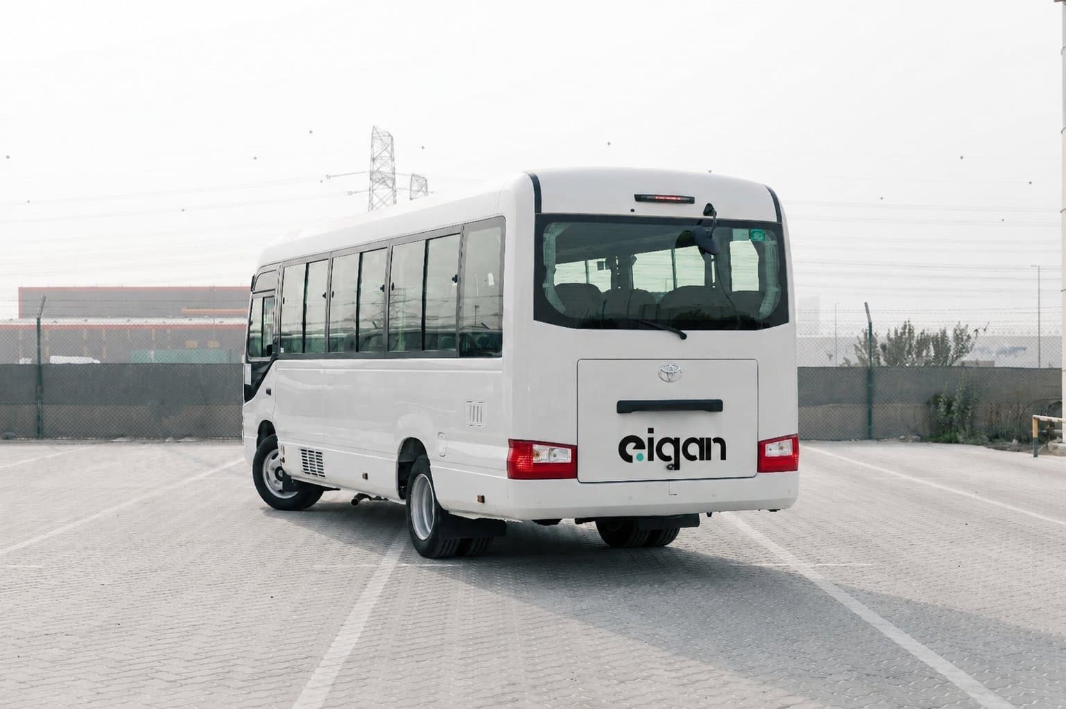 EIQAN-branded rental bus, rear view
